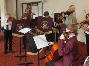Nicoline and Lisa lead the young strings at Prince George (Masonic) Duke of Kent Home